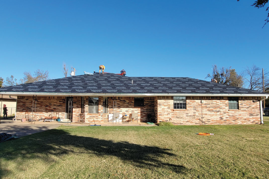 roofing installation experts preparing a roof to receive new shingles in Oklahoma City