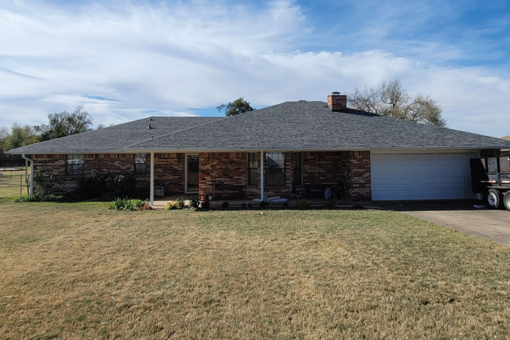 completed grey shingle residential roofing project in Oklahoma City by the experts at Reynolds roofing